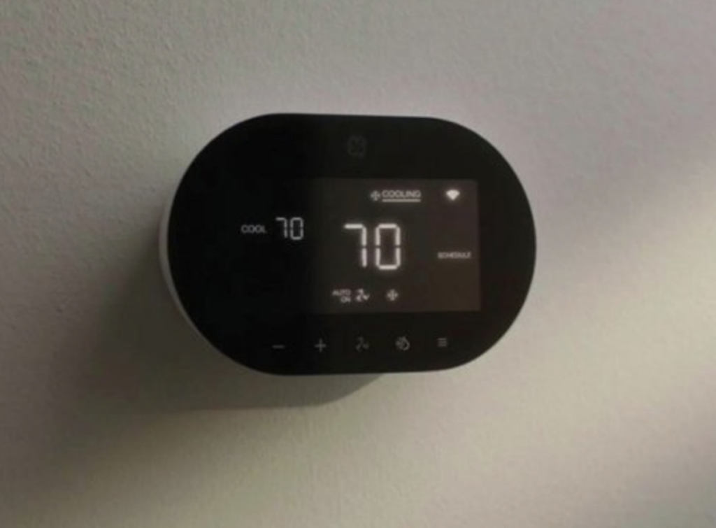 GE CYNC smart thermostat on wall