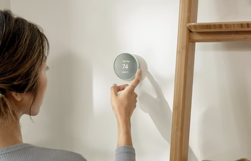 Google Nest smart thermostat on wall