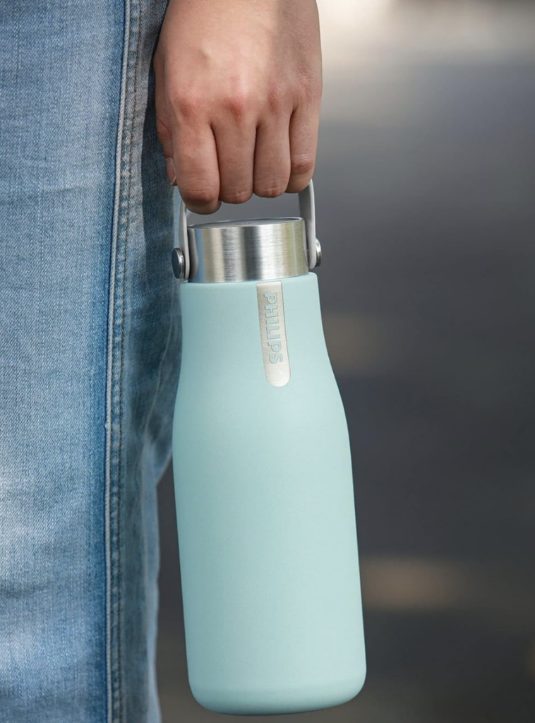 woman holding a smart water bottle at her side
