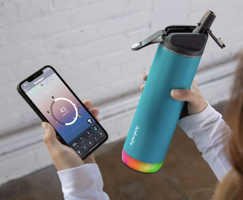 blue smart water bottle and smartphone tracking